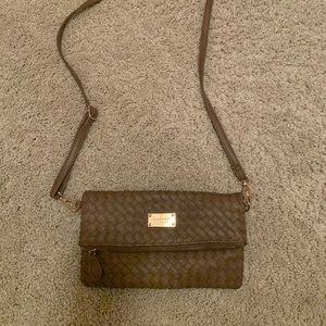 Taupe colored crossbody bag with adjustable strap